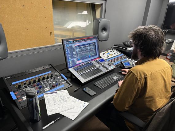 A UW student works at the recording console in Control Room A (Photo: Coen Rios).