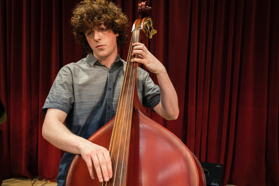 Student bassist (Photo: Mark Stone, UW Photography).