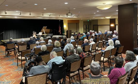Doctoral piano student Chiao-Yu Wu performs for residents of the Mirabella senior community (Photo: Rylan Virnig).
