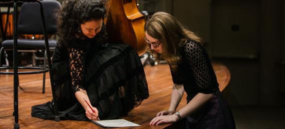 Young composers work at Benaroya Hall.