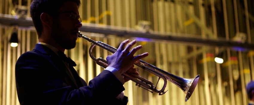 Back-lit trumpet player