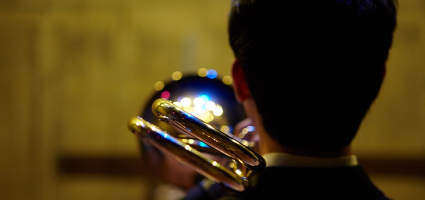 Trombonist viewed from behind