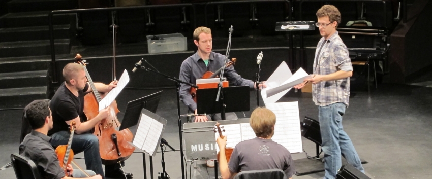 Composition student Josh Archibald-Seiffer receives notes from the JACK Quartet