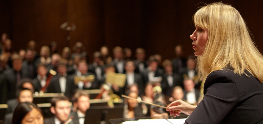 Giselle Wyers conducting the combined UW symphony and choirs (Photo: Steve Korn).