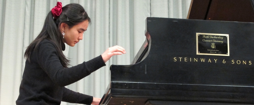 Piano student Rose Cheng performs in a master class for guest artist Paul Roberts.