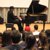 Piano player in Brechemin Auditorium