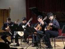 UW Guitar Ensemble students playing guitars