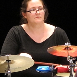 Female student playing the drums - percussion ensemble