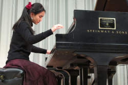 Piano student Rose Cheng performs in a master class for guest artist Paul Roberts.