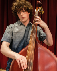 Student bassist (Photo: Mark Stone, UW Photography).
