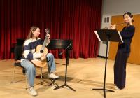 Student guitarist and flutist in Brechemin Auditorium (Joanne DePue photo).