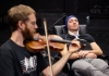 Music/DXARTS postdoc Marcin Pączkowski prepares JACK Quartet violinist Austin Wulliman for an EEG session