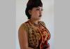 A female dancer models the costume for the male-style dance Ngremo Tayub. Photo by Christina Sunardi.