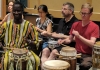 Teachers drumming during the world music pedagogy workshop.