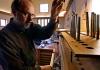 Paul Fritts working on an organ being built in his shop.