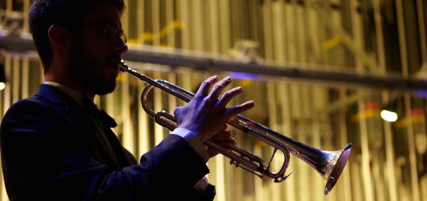 Back-lit trumpet player