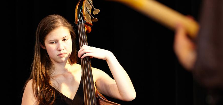 Jazz Studies major Carmen Rothwell, bass, in performance at the 2013 Improvised Music Project Festival (Photo: Steve Korn).