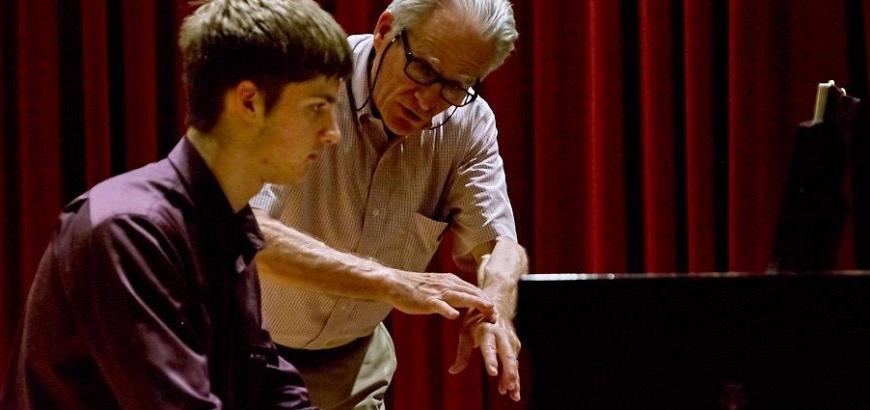 Craig Sheppard works with piano student