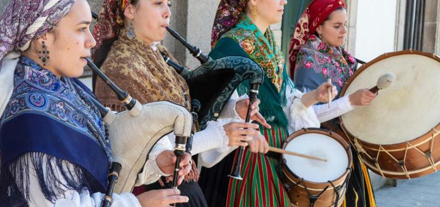 Via Getty: &quot;A group of young women in traditional costumes play Galician music with bagpipes, tambourines and drum in the historic center during the San Froilan festivities on October 6, 2019 in Lugo, Galicia, Spain.&quot; ( Xurxo Lobato/Getty Images)