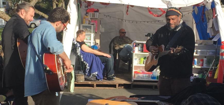 Playing guitar at Tent City 3 - UW Music