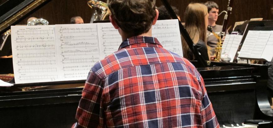 UW music student in rehearsal with the Wind Ensemble.