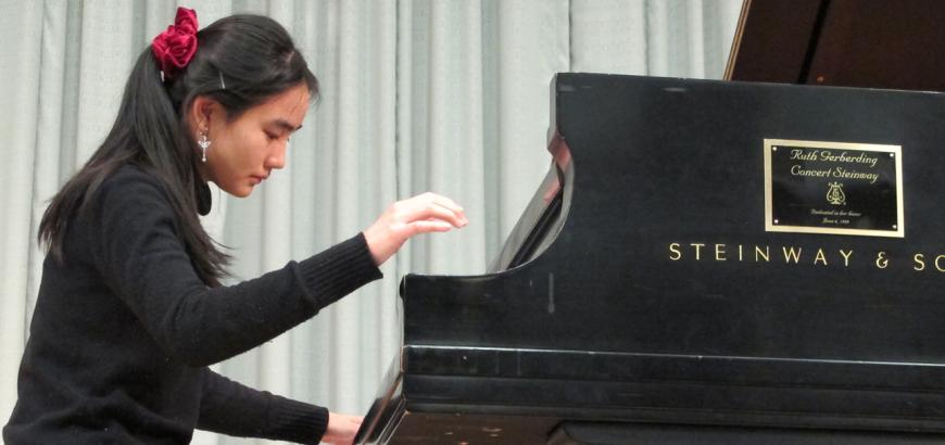 Piano student Rose Cheng performs in a master class for guest artist Paul Roberts.