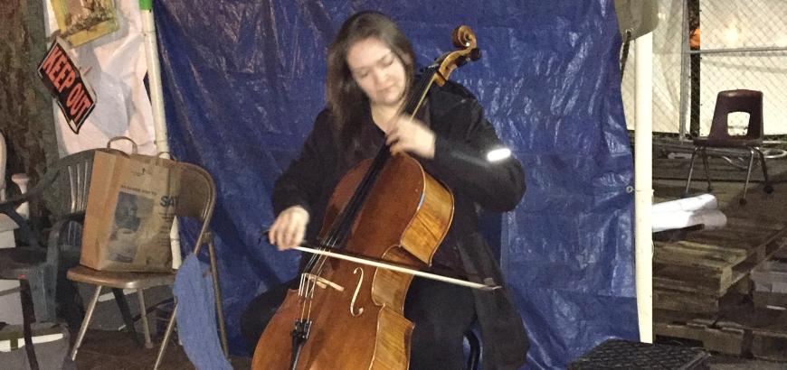 Faculty cellist Sæunn Thorsteinsdóttir performs at Tent City 3.