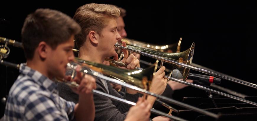 UW Studio Jazz Ensemble: Big Band, trombone players (photo: Steve Korn)