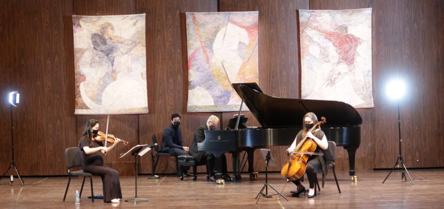 Faculty colleagues Craig Sheppard, Sæunn Thorsteinsdóttir, and Rachel Lee Priday perform a masked and distanced recital at Meany Hall (Photo: Gary Louie).