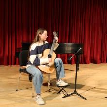 Student guitarist and flutist in Brechemin Auditorium (Joanne DePue photo).